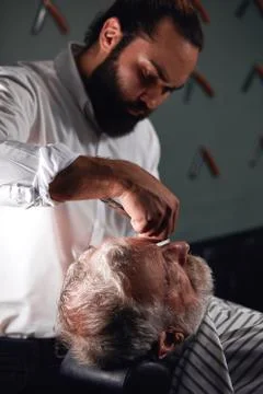 Professional talented barber doing his great job Stock Photos