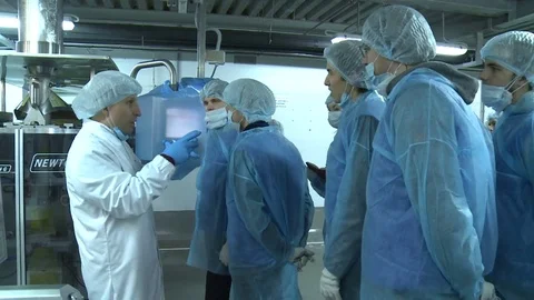 Professional Talks to People About Vegetable Processing Stock Footage 79860524