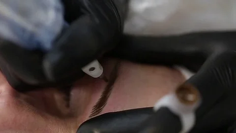 Professional tattooist making permanent make up Stock Footage 73767839