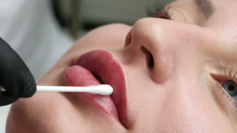 Professional tattooist making permanent make up. close-up. Stock Footage 92334456