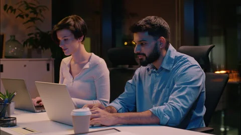 Professional team co-workers multiracial business man woman in dark night office Stock Footage 306872418