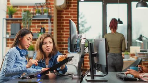 Professional team of developers working with 3d graphics software Stock Photos