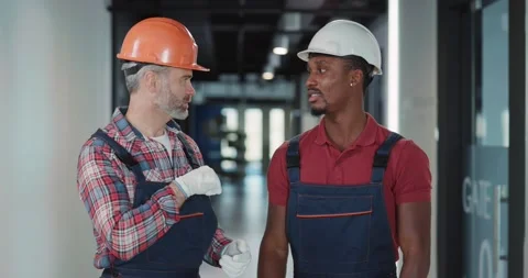 Professional Team of Electric Engineer and Architect Communicating Posing for Stock Footage 149854015