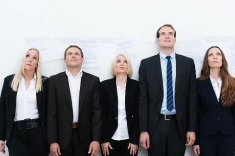 Professional team looking up Stock Photos
