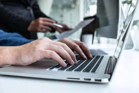 Professional Team of programmer working on project in software development co Stock Photos