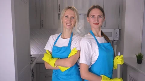 Professional team of uniformed cleaners working in modern loft apartment. Stock Footage 231330004