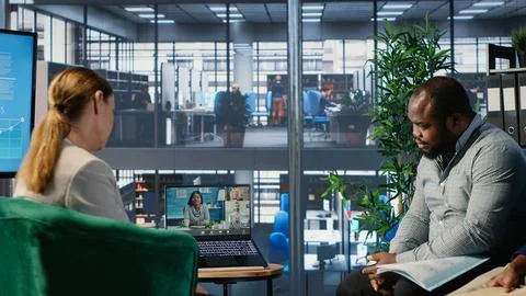 Professional team using video call technology to support company development Stockfoto's
