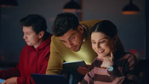 Professional teammates brainstorming on startup checking data on tablet closeup. Stock Footage 340168333