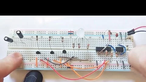 Professional Tech: From IC Chip Removal to Breadboard Circuit Simulation Stock Footage 333610580