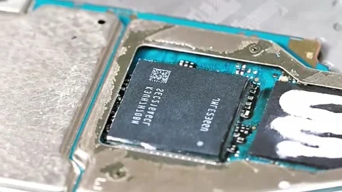 ): Professional Technician Removing IC Chip from Smartphone Motherboard Stock Footage 333610563