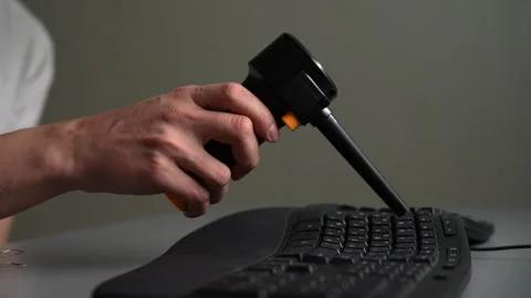 Professional technician using cordless electric air duster to blow dust and 스톡 동영상 342763467