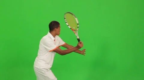 Professional tennis player makes different types of shots on a green screen Stock Footage 59508938