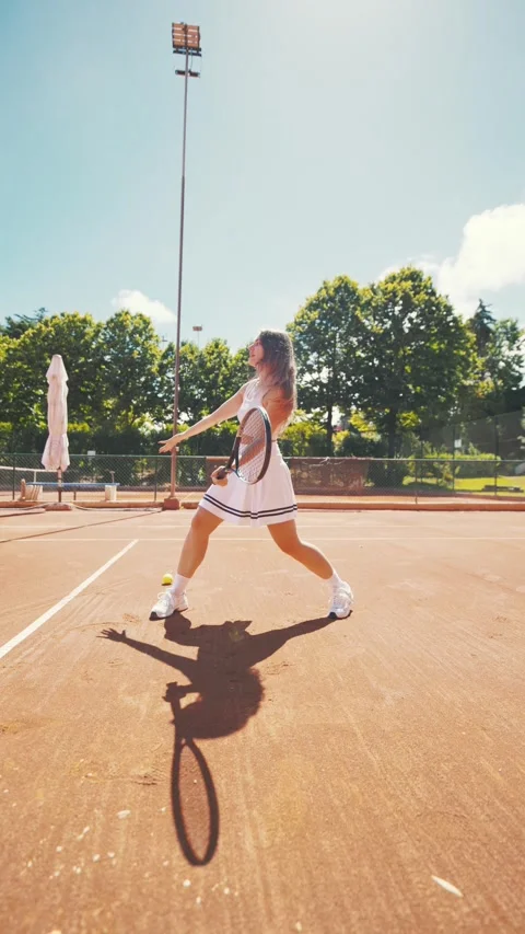 Professional tennis player practicing forehand on a clay court Stock Footage 338243401
