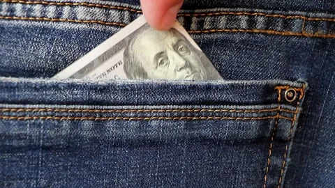 Professional thief takes money from the back pocket of jeans. Stock Footage