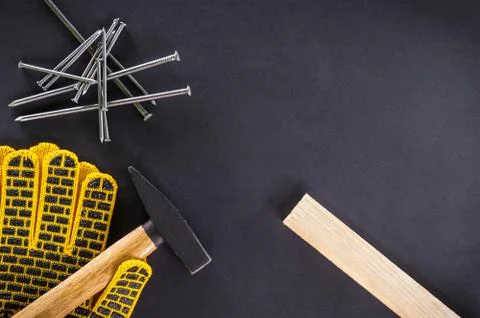 Professional tools for carpentry and accessories on a black background. Stock Photos