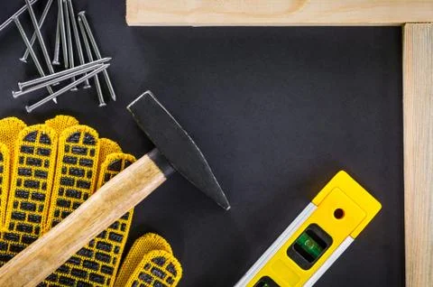 Professional tools for carpentry and accessories on a black background. Stock Photos