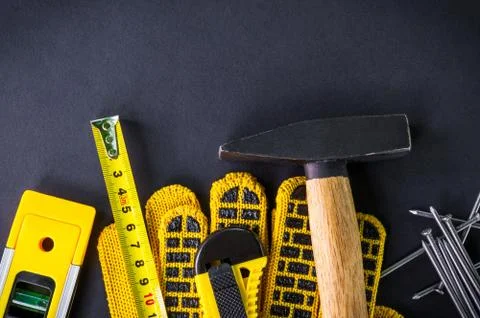Professional tools for carpentry and accessories on a black background. Stock Photos