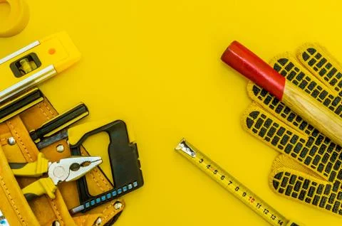 Professional tools for the master builder on a yellow background. Stock Photos