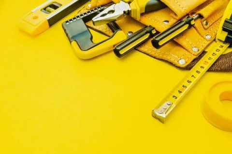 Professional tools for the master builder on a yellow background. Stock Photos