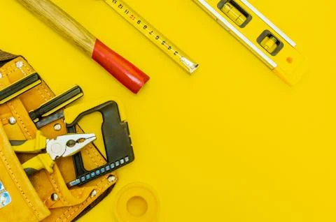 Professional tools for the master builder on a yellow background. Stock Photos