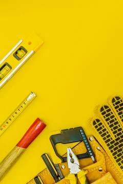 Professional tools for the master builder on a yellow background. Stock Photos