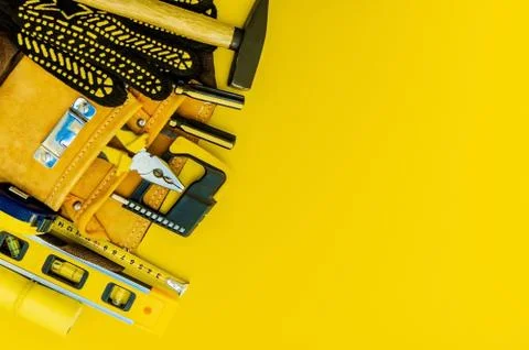 Professional tools for the master builder on a yellow background. Stock Photos