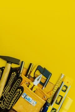 Professional tools for the master builder on a yellow background. Stock Photos