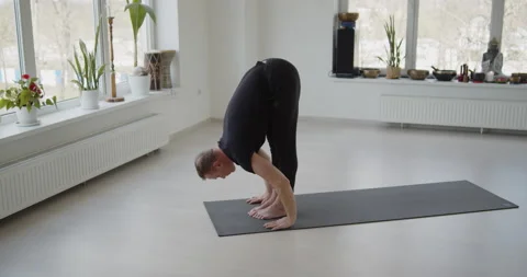 Professional trainer practices flow yoga in private class Stock Footage 156765668