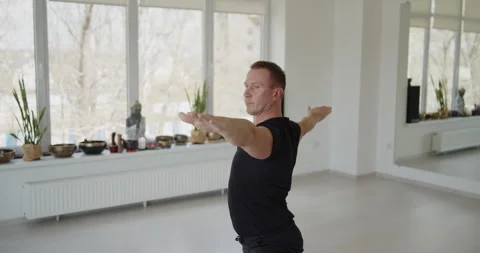 Professional trainer practices flow yoga in private class Stock Footage 156765739