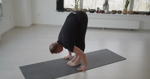 Professional trainer practices flow yoga in private class Stock Footage 156765819