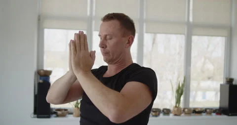 Professional trainer practices flow yoga in private class Stock Footage 156765920