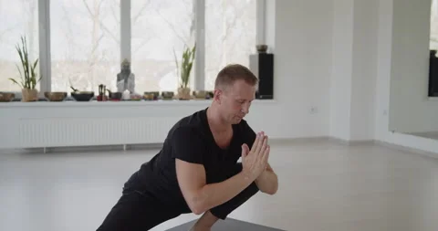 Professional trainer practices flow yoga in private class Stock Footage 156766227