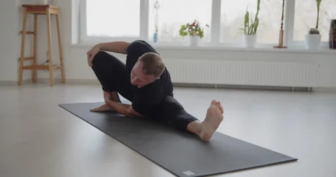 Professional trainer practices flow yoga in private class Stock Footage 156766319