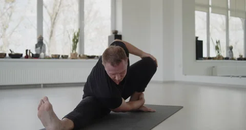 Professional trainer practices flow yoga in private class Stock Footage 156766676