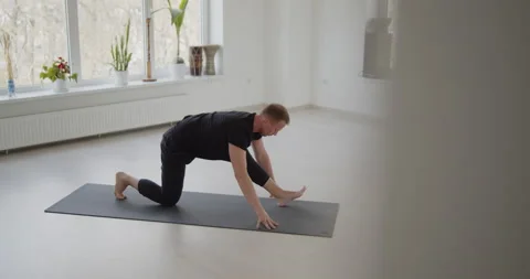 Professional trainer practices flow yoga in private class Stock Footage 156766953