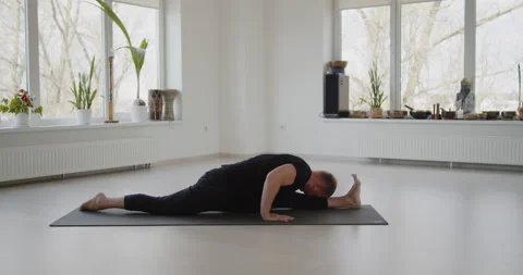 Professional trainer practices flow yoga in private class Stock Footage 156767016