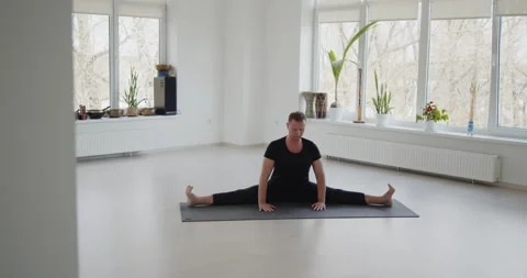 Professional trainer practices flow yoga in private class Stock Footage 156767243