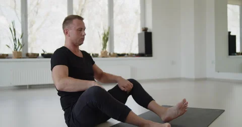 Professional trainer practices flow yoga in private class Stock Footage 156767497