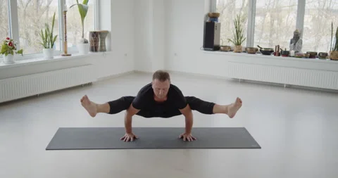 Professional trainer practices flow yoga in private class Stock Footage 156767689