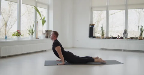 Professional trainer practices flow yoga in private class Stock Footage 156768260