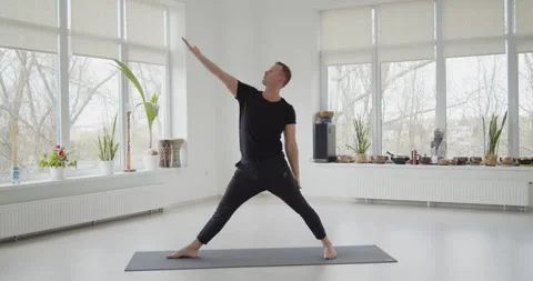 Professional trainer practices flow yoga in private class Stock Footage 156768407