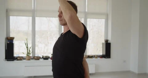 Professional trainer practices flow yoga in private class Stock Footage 156768764