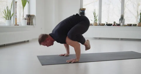 Professional trainer practices flow yoga in private class Stock Footage 156768902