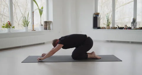 Professional trainer practices flow yoga in private class Stock Footage 156768948