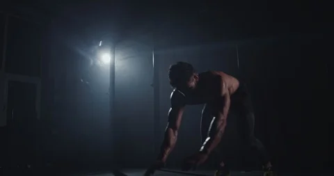 Professional training workout guy with a strong body doing push-ups in a large Video stock 125480343