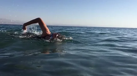 Professional triathlete practicing in open water. Swimming in sea. Triathlon Stock Footage 62316554