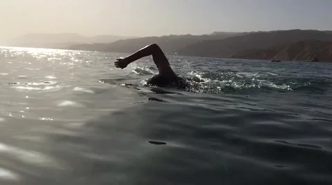 Professional triathlete practicing in open water. Swimming in sea. Triathlon Stock Footage 62316570