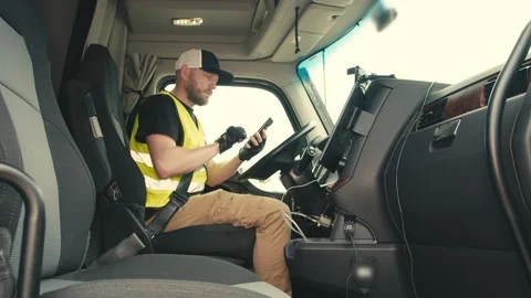 Professional truck driver using smartphone for navigation Stock-Footage 346970993