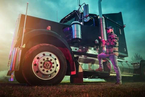 Professional Trucker Getting Inside His American Semi Tractor Stock Photos