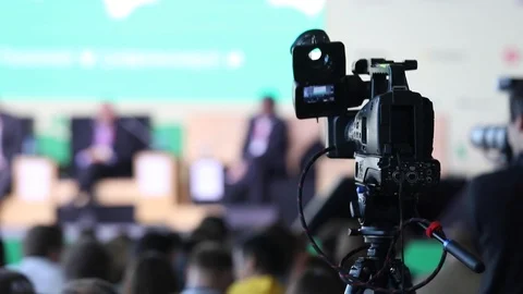 Professional Tv Camera Broadcasts The Speakers Of Forum, Selective Focus Stock-Footage 106615918